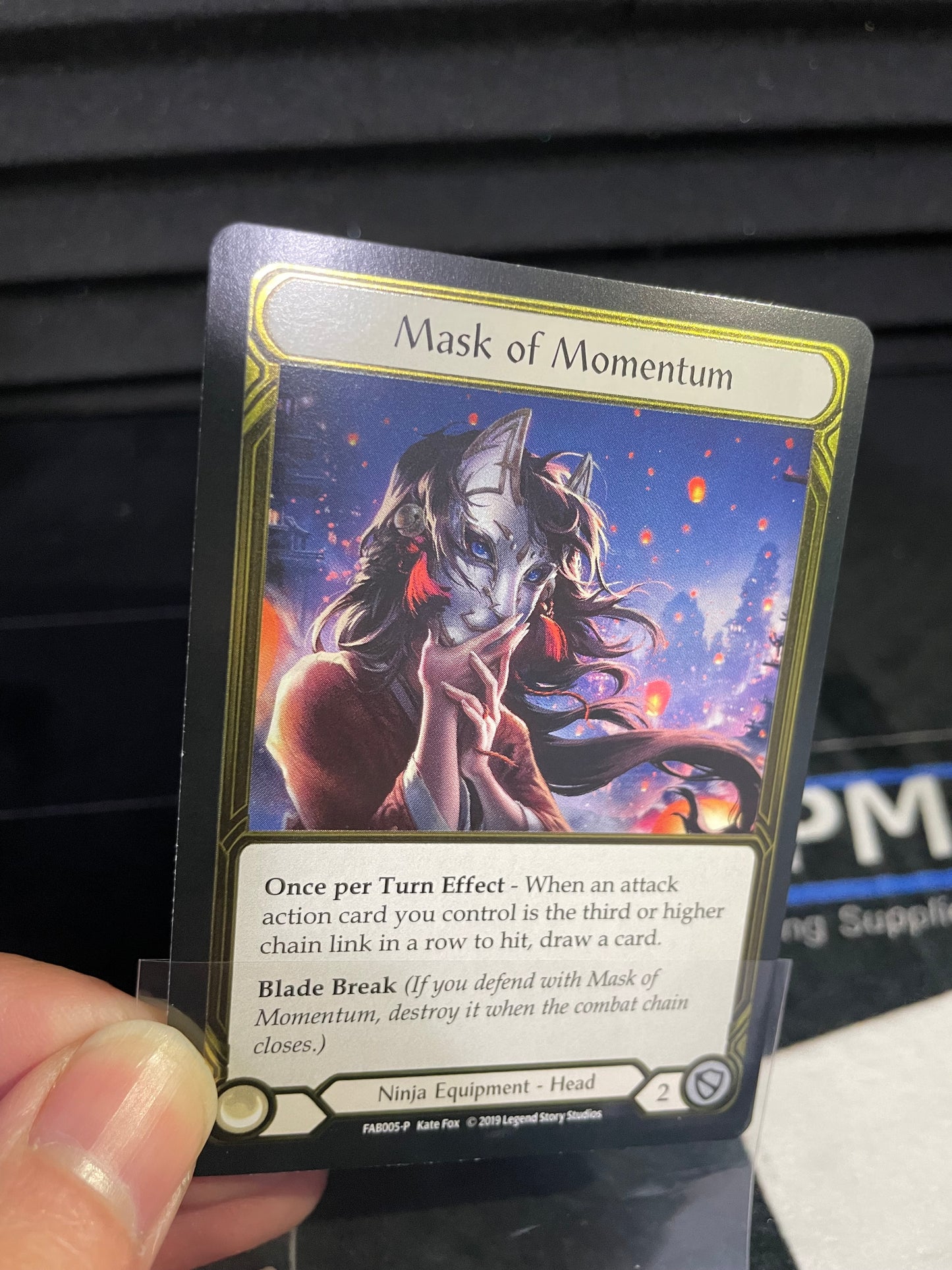 Mask of Momentum Gold Cold Foil Trophy Card Light Play