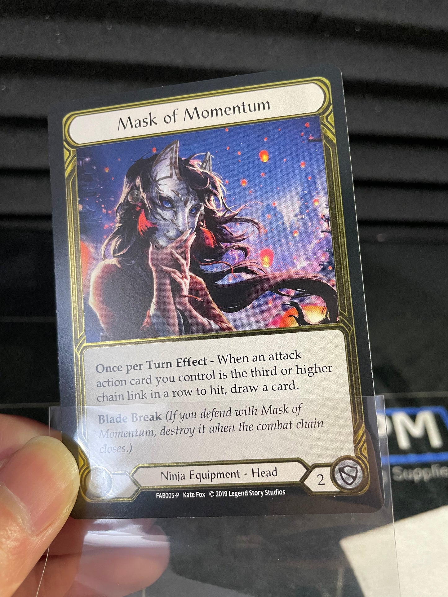 Mask of Momentum Gold Cold Foil Trophy Card Light Play